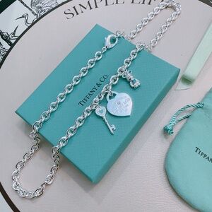 Tiffany & Co. Silver Heart and Key Charm Bracelet with Blue Accents